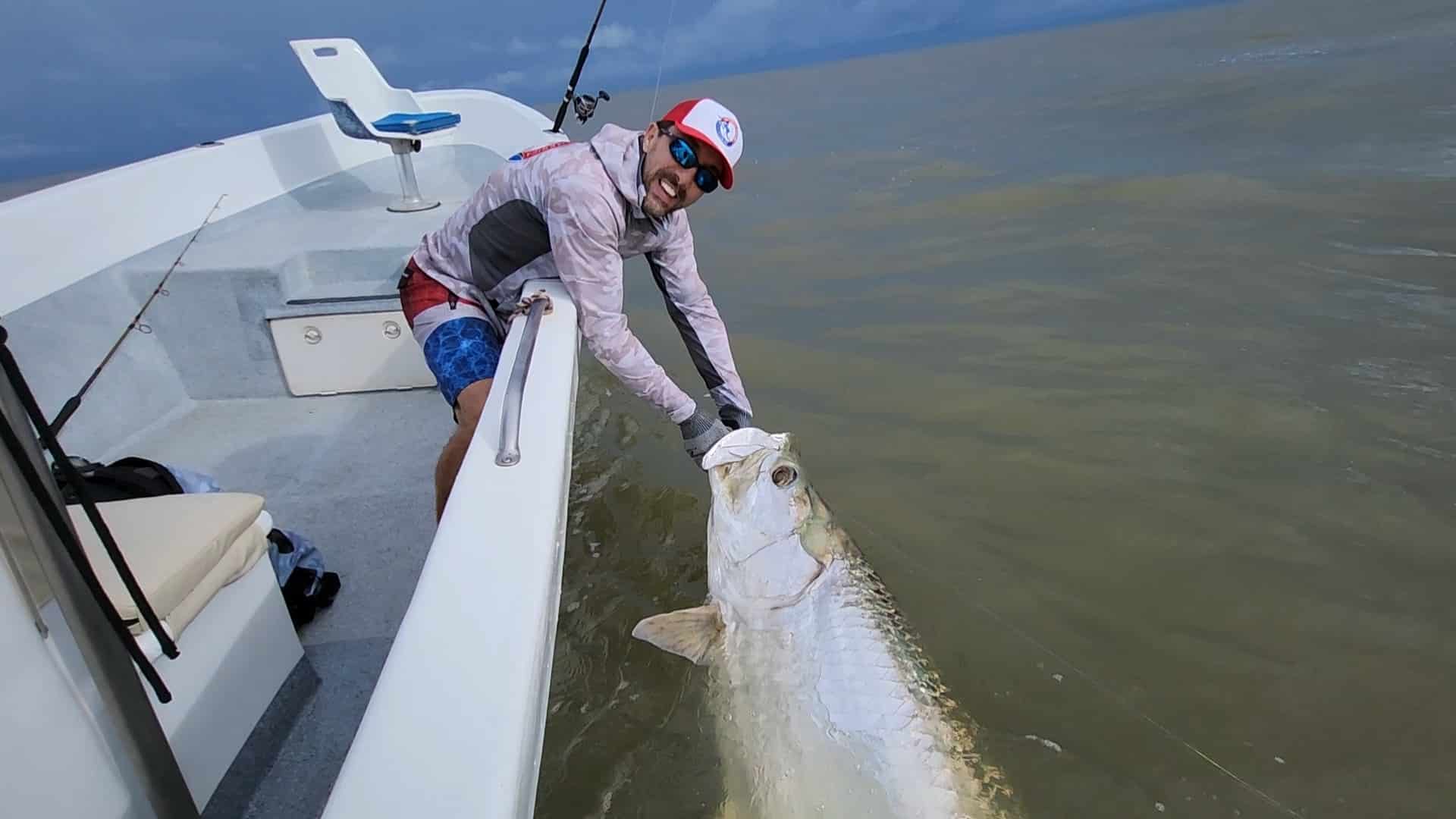 Central America Fishing owner, Chris Atkins, releases a tarpon in Costa Rica