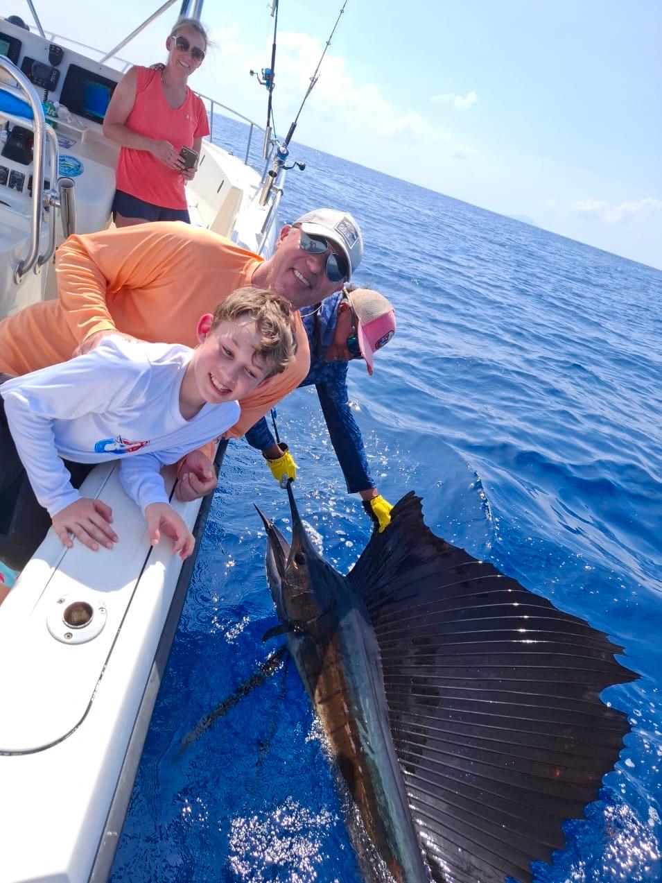 Central America Fishing clients, the Brannon family, release a sailfish in Panama
