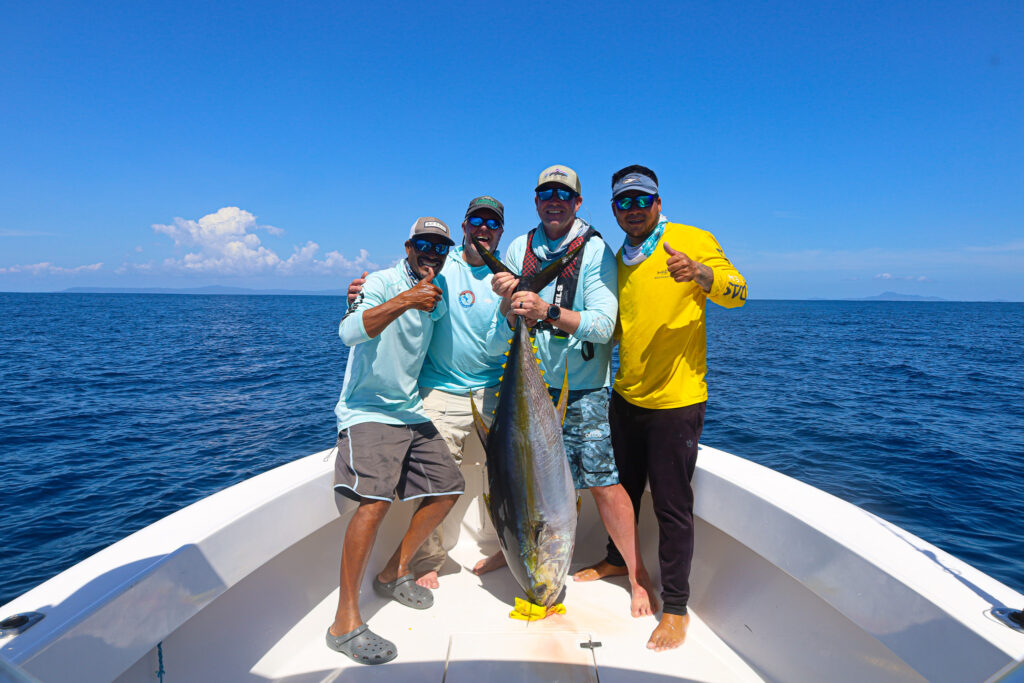 Jeff & Tim pose with their crew of Navas & Yeti after landing a big tuna near the Hannibal Bank