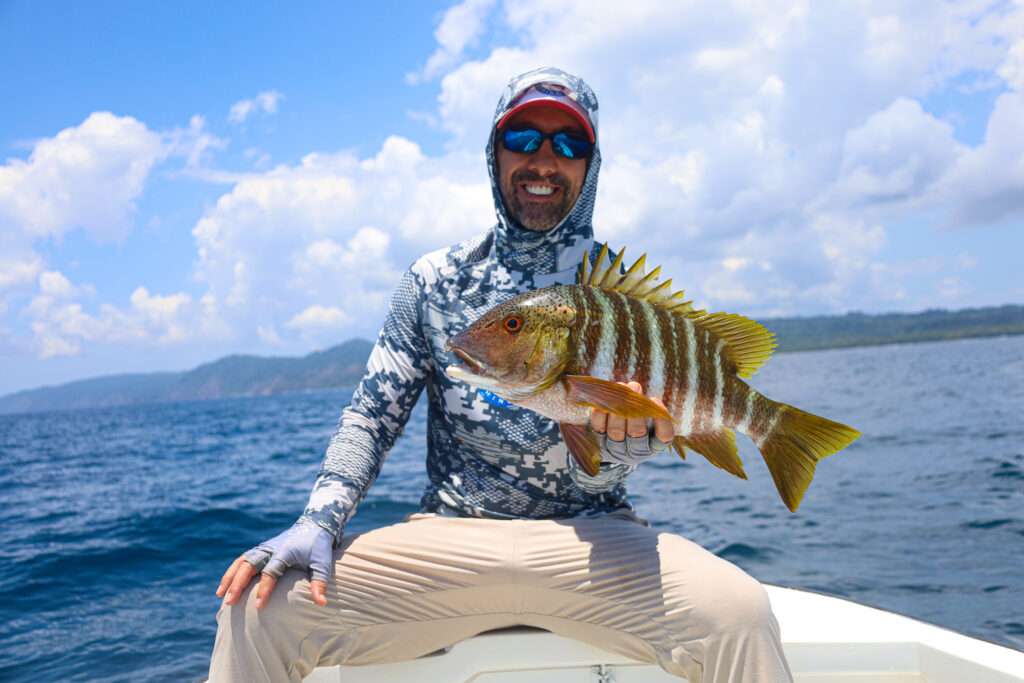 CAF owner, Chris Atkins, with a rock snapper near Coiba Island, Panama