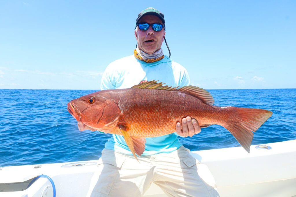 CAF angler Tim releases a cubera snapper
